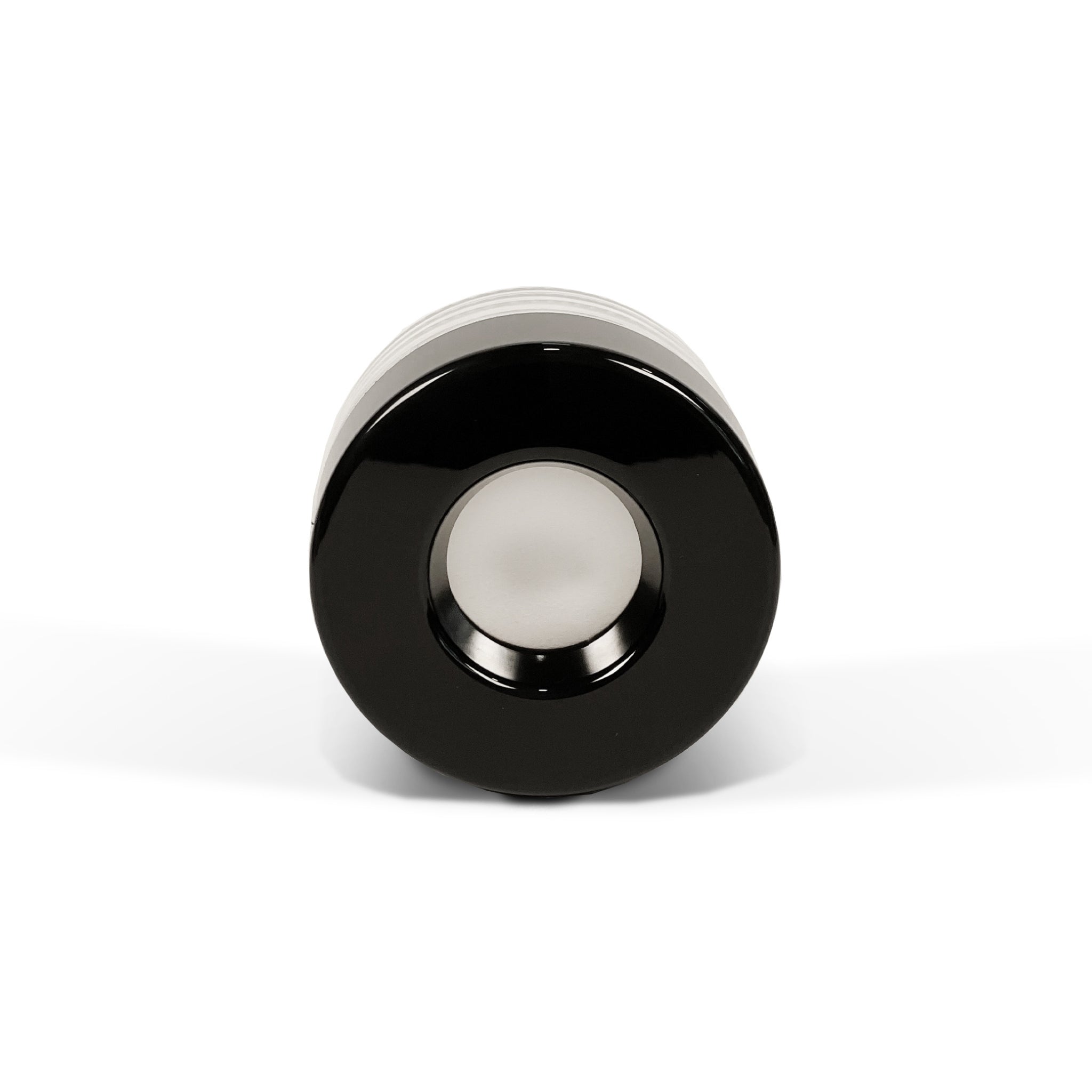 A render showing the top view of a black on clear Pop Vac 100ml eighth ounce flower jar with a focus on the lid's center hole stainless steel vacuum disk 