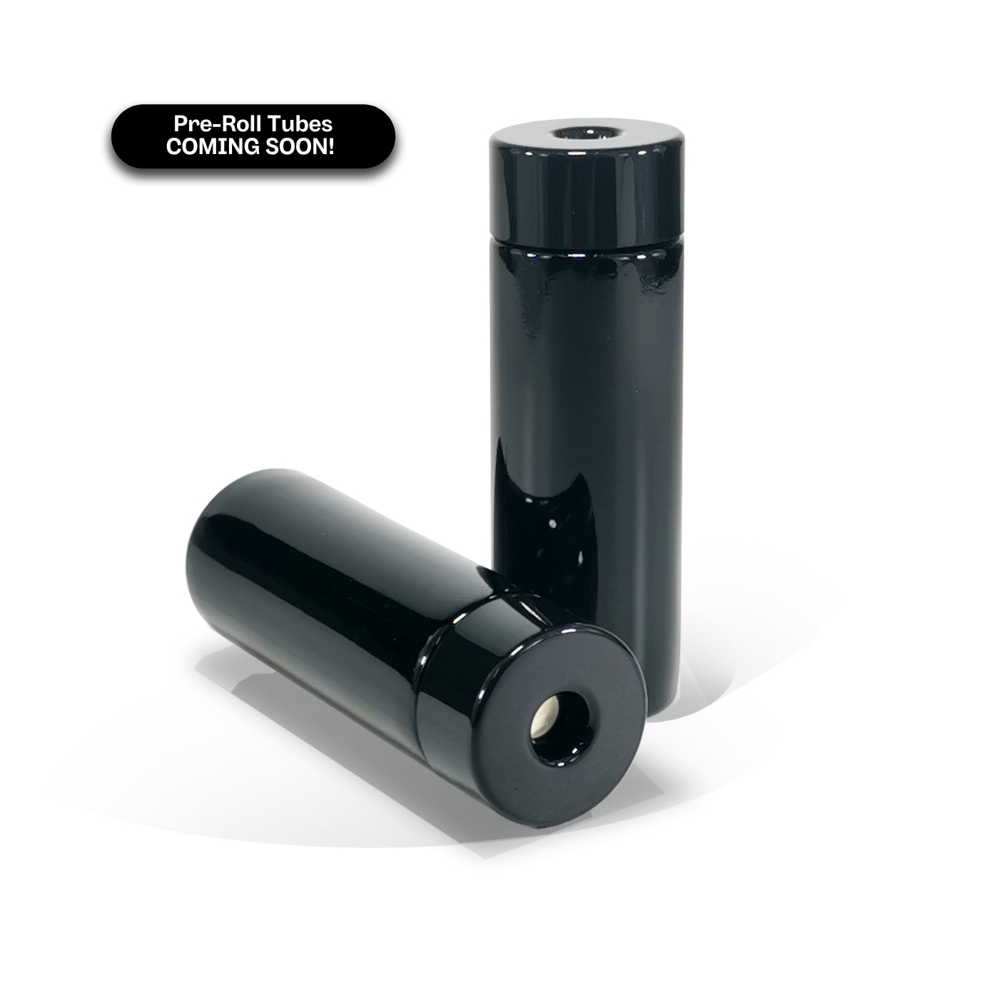 Two Black POP VAC Pre-roll tubes showing one jar on its side with the top of the lid facing the viewer but slightly angled to the right and a second POP VAC pre-roll tube on the right of the angled one standing upright. There's a black pill shaped text box in the upper left hand corner that says: Pre-Roll Tubes COMING SOON! 